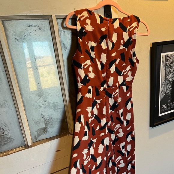 Want major power vibes? This Lush silky deep orange, navy& white jumpsuit is it - Picture 9 of 14